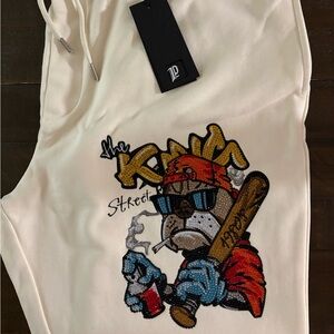 Left Point, Luxury Streetwear sweatpants, white with bezelled dog print.